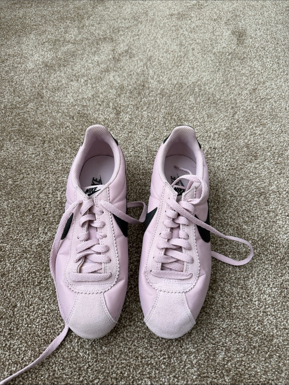 Nike Women’s Light Pink Sneakers with Black Swoosh